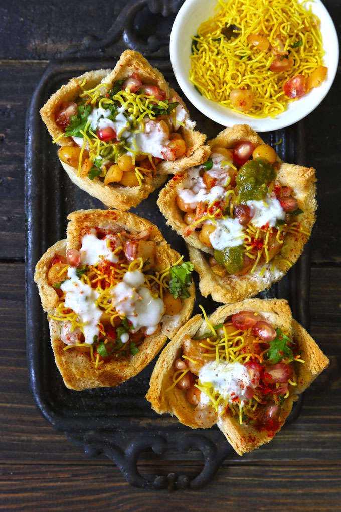 Aerial shot of basket chaat on a black tray.