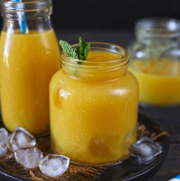 Side shot of mango iced tea in a mason jar.