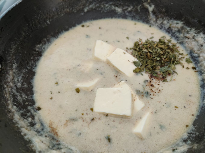 Cooking step of paneer in white gravy