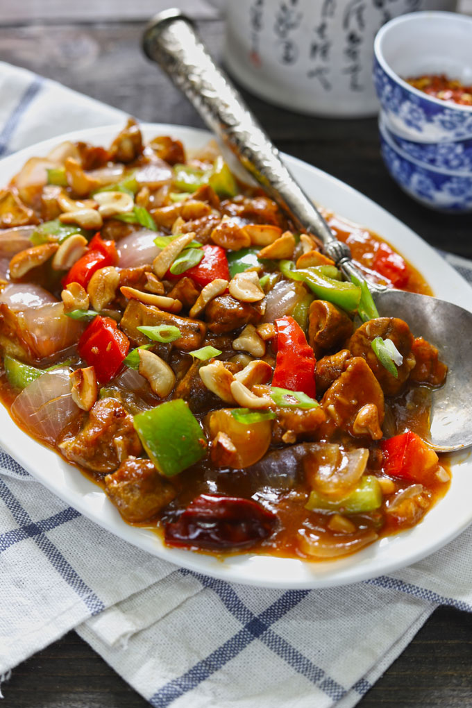 side shot of chilli mushroom in a white ceramic platter