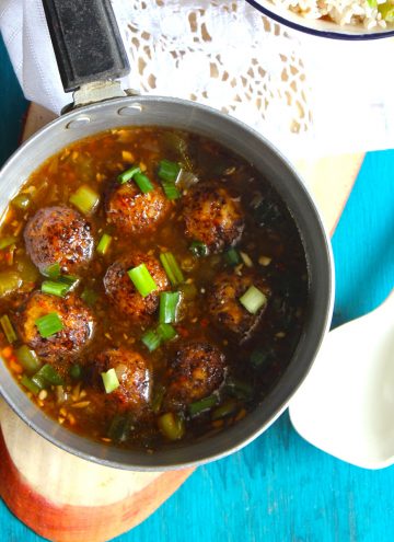 aerial shot of veg manchurian gravy in a silver saucepan