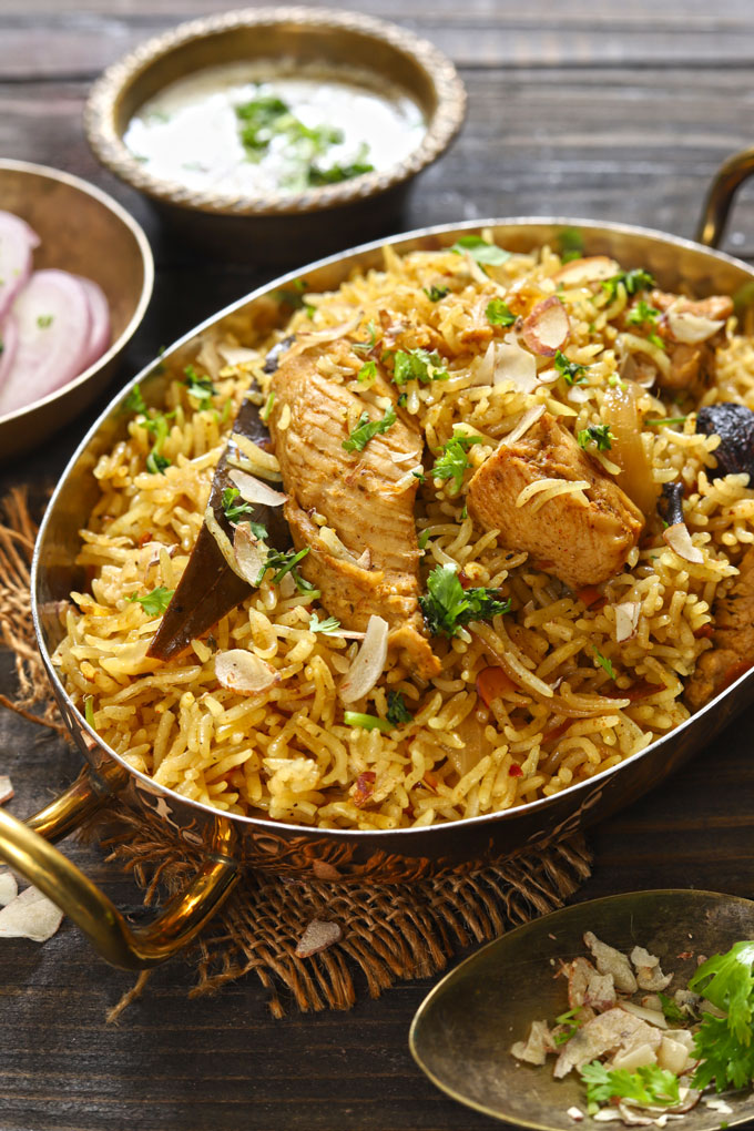 side shot of chicken pulao in an oval serveware