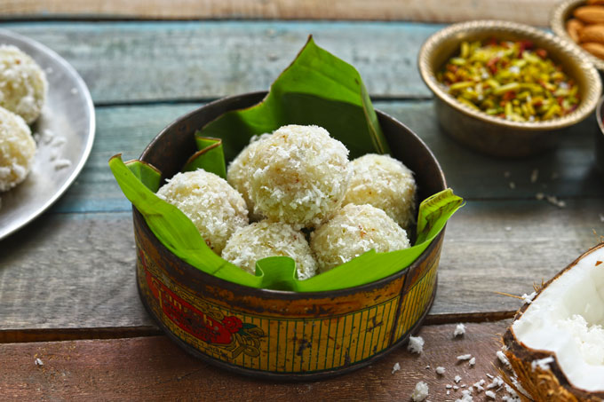 side shot of coconut laddo in a box