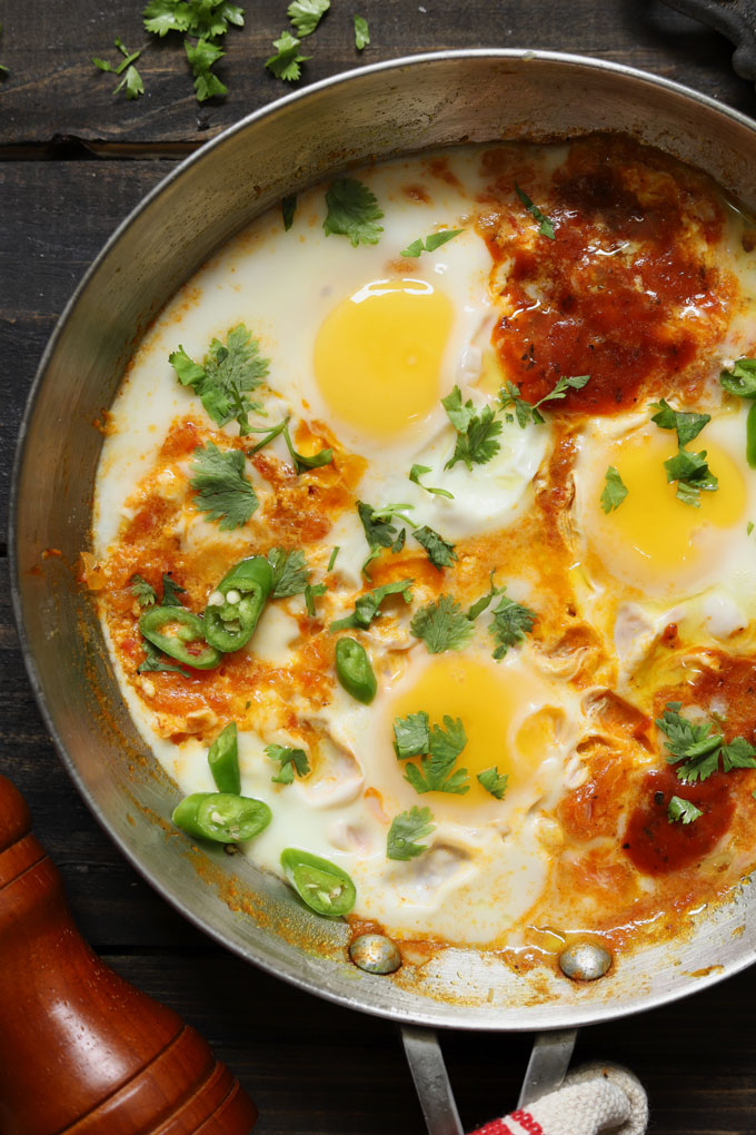 close up aerial shot of shakshuka in a cooking pan