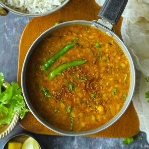 aerial shot of panchmel dal in a aluminium saucepan