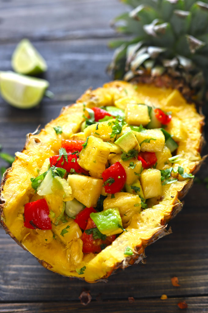 aerial side shot of pineapple salsa on a fresh pineapple