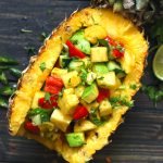 aerial shot of pineapple salad served on fresh pineapple