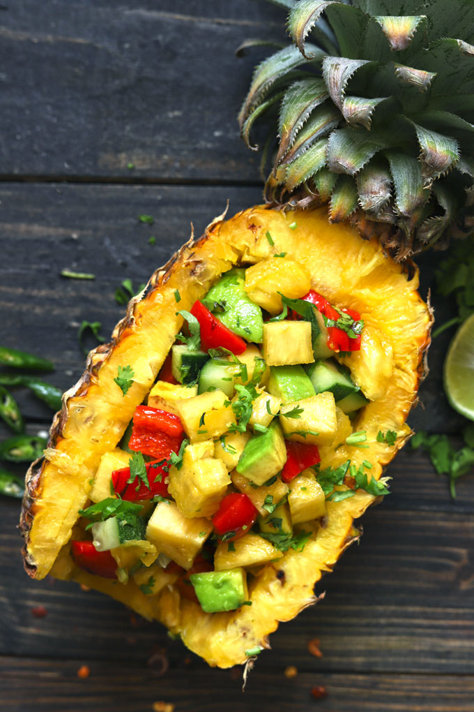 aerial shot of pineapple salsa served on fresh pineapple