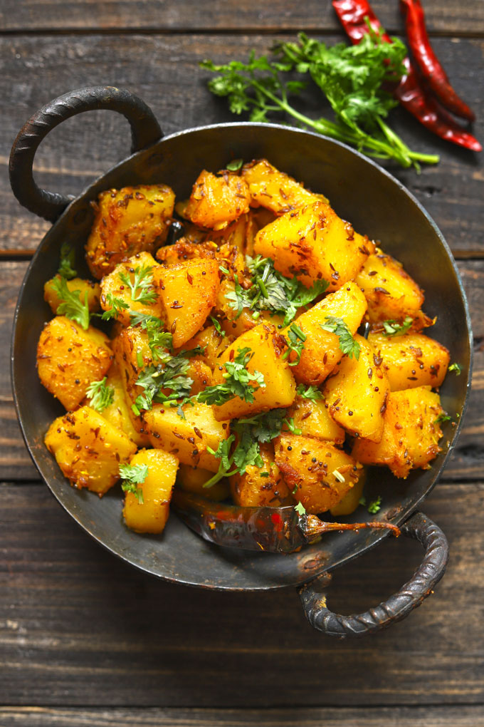 aerial shot of aloo gutka in a cast iron skillet