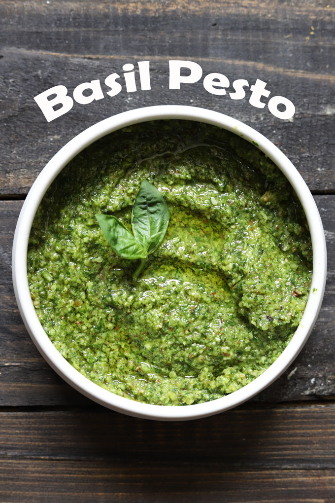 aerial shot of basil pesto in a white ceramic bowl