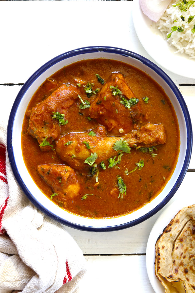 aerial shot of chicken curry in a white bowl