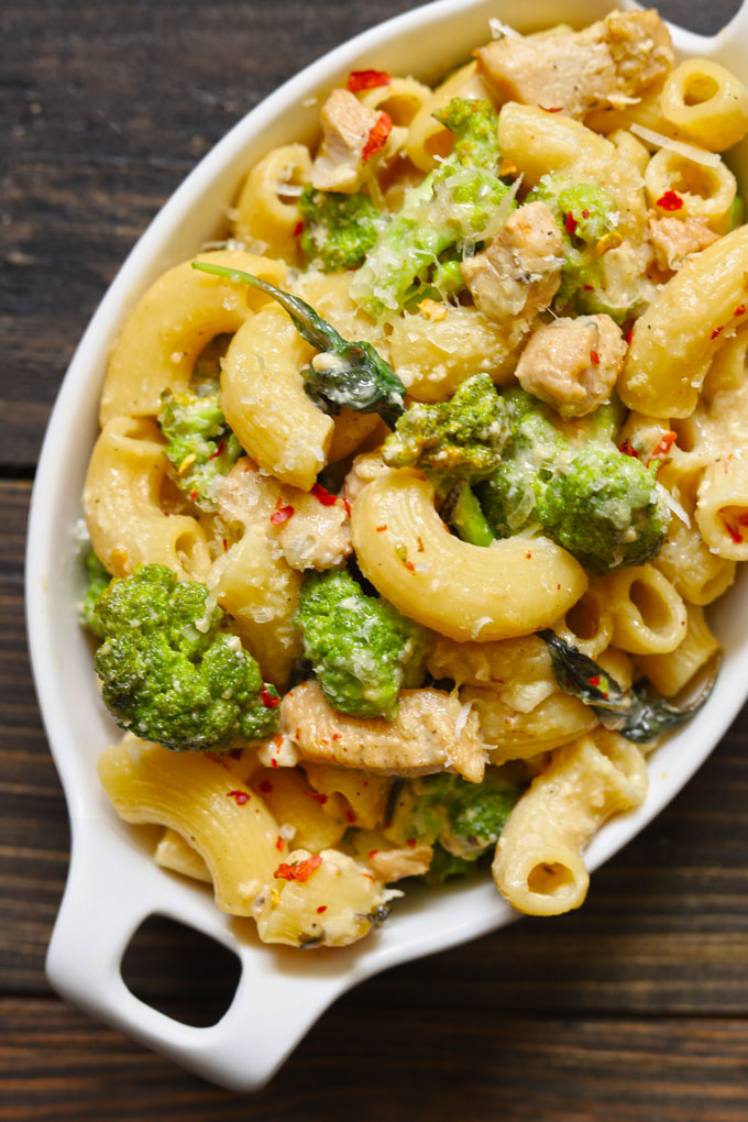 aerial shot of chicken broccoli pasta in a white baking dish