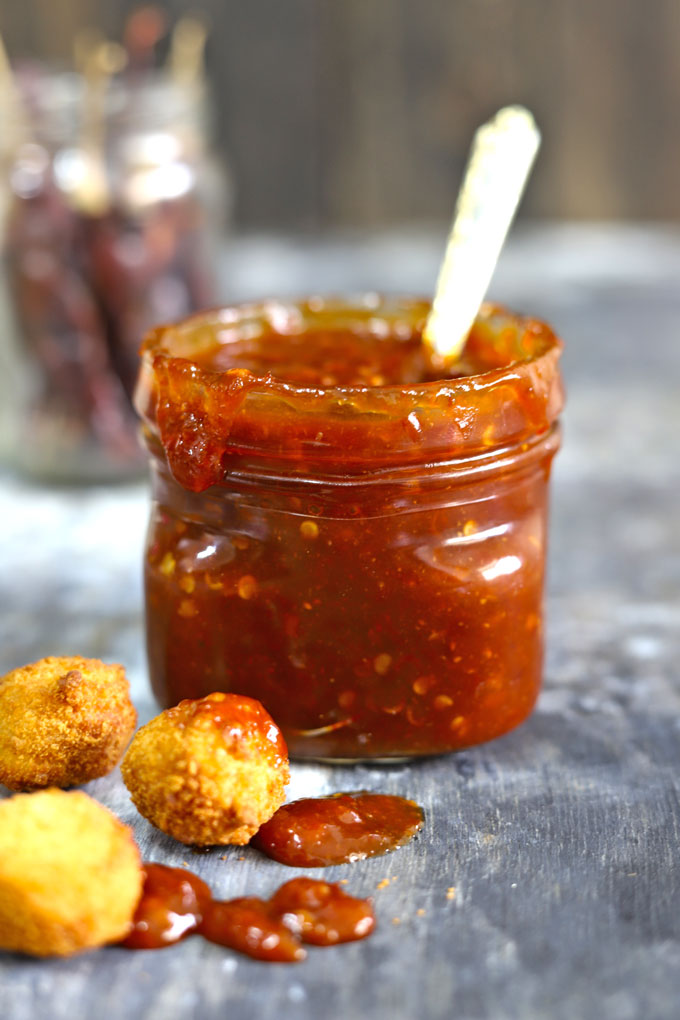 side shot of sweet chilli sauce in a glass jar