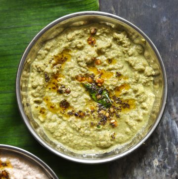 aerial shot of green coconut chutney in a steel bowl