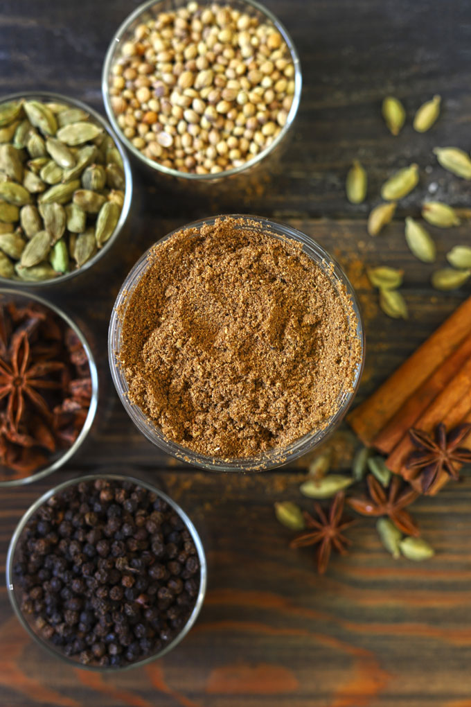 aerial shot of garam masala powder in a glass bottle