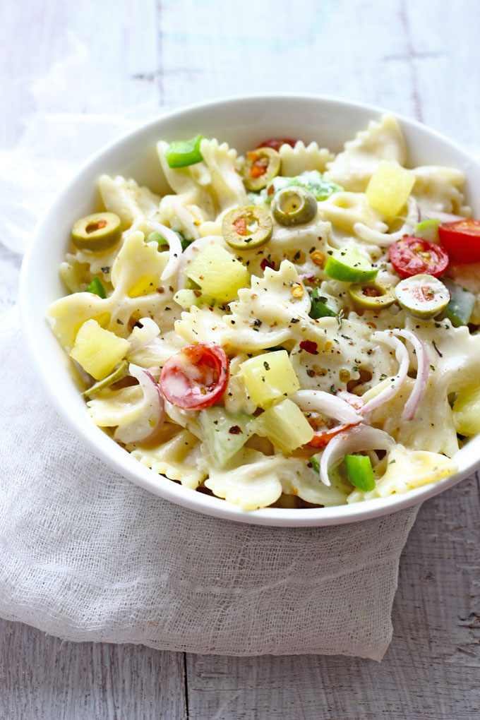 side close up shot of pasta salad in a white ceramic bowl