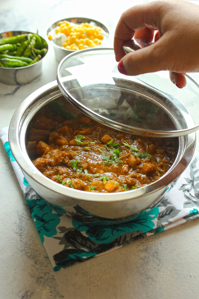 side shot of curry in a casserole for potluck