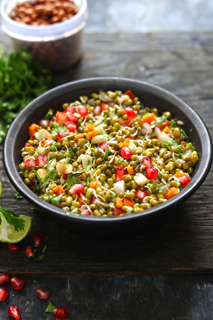 side shot of sprouts salad in a black serving bowl