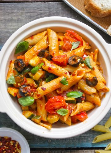 aerial shot of tomato sauce pasta in a cream ceramic bowl