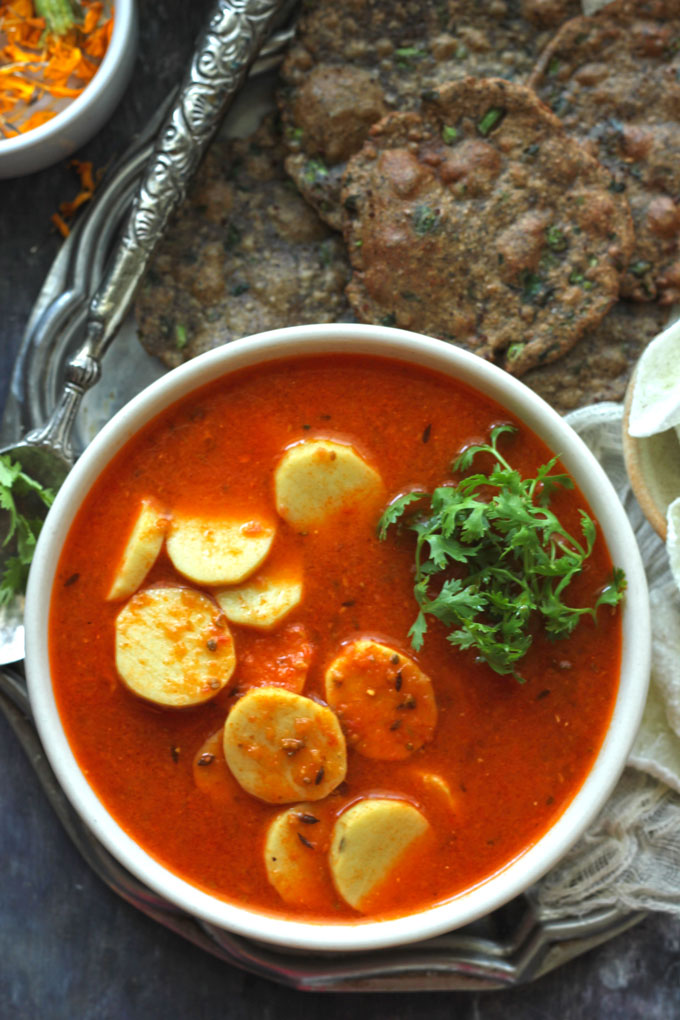 aerial shot of arbi ki sabzi in a white ceramic bowl