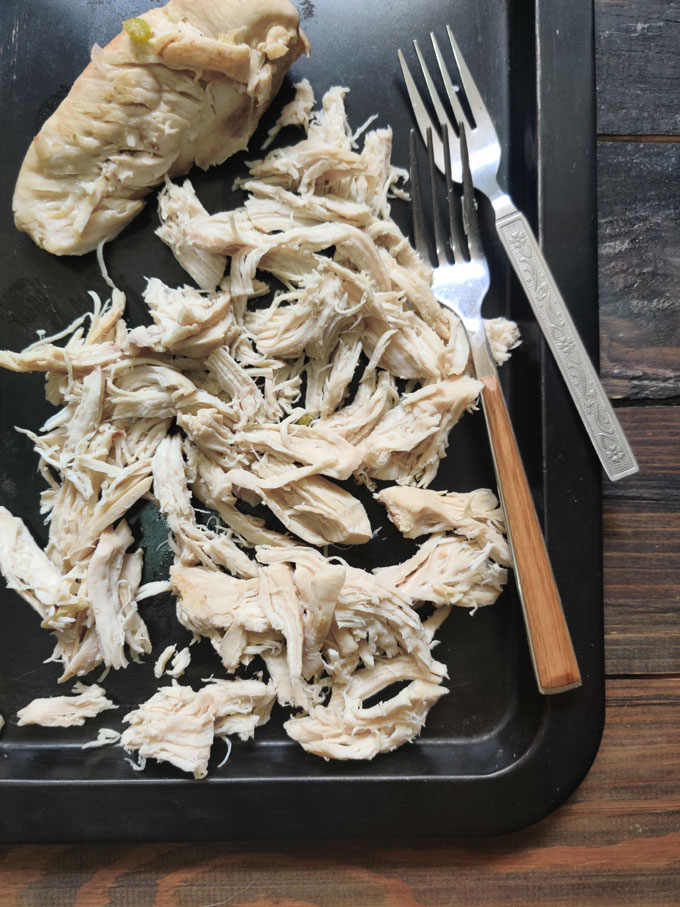 aerial shot of shredded chicken for soup