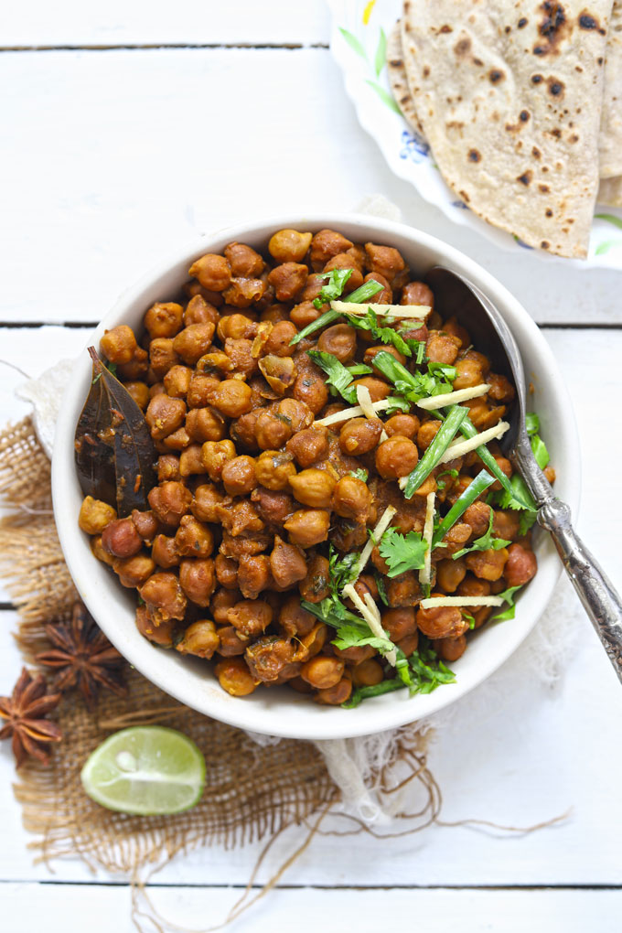 aerial shot of kala chana masala in a white ceramic bowl