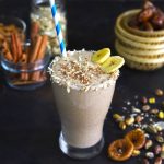 side close up shot of date milkshake in a glass