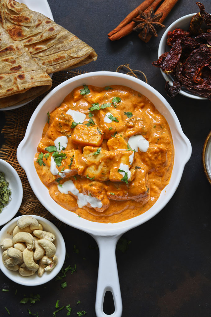 aerial shot of paneer butter masala on a white pan