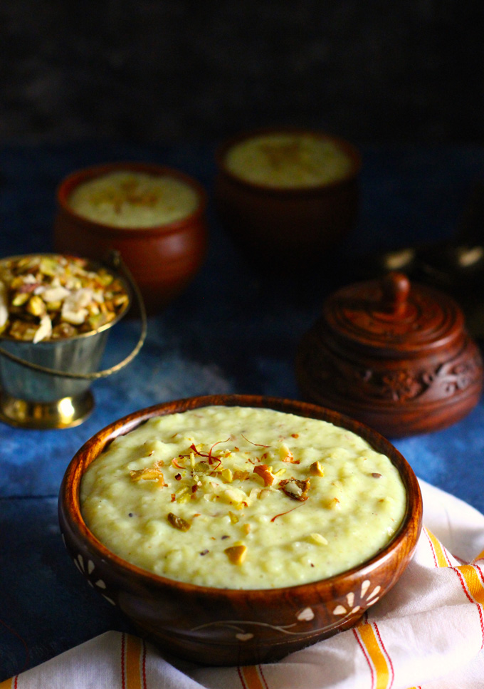 side shot of phirni in an wooden bowl