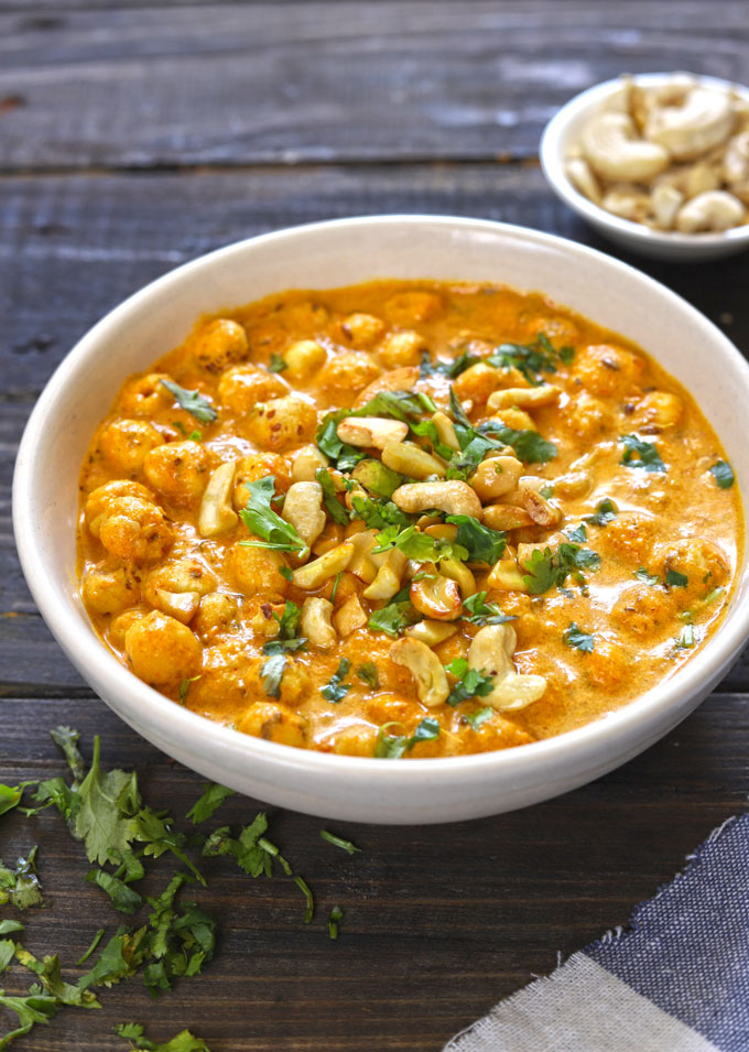 side close up shot of phool makhana curry in a white ceramic bowl