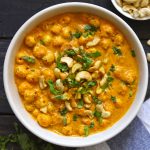 aerial shot of phool makhana curry in a cream ceramic bowl