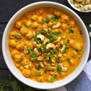 aerial shot of phool makhana curry in a cream ceramic bowl