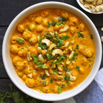 aerial shot of phool makhana curry in a cream ceramic bowl