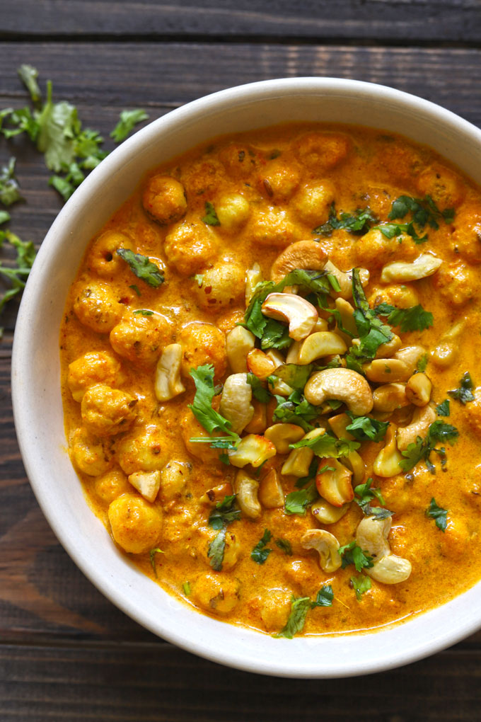 aerial shot of phool makhana curry in a white ceramic bowl 