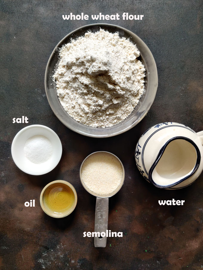 aerial shot of poori ingredients on a black surface