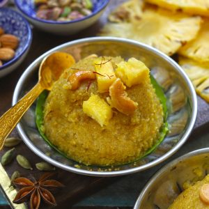 side close up shot of pineapple rava kesari in a steel platter