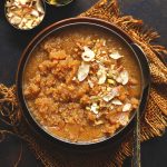 aerial shot of suji halwa in a stainless steel bowl