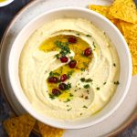 aerial shot of hummus in a white ceramic bowl