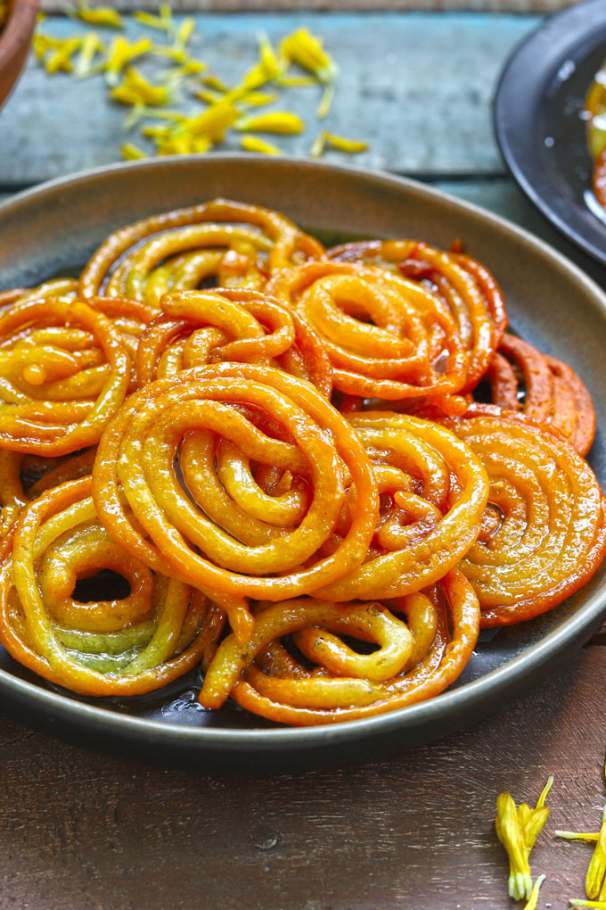 side close up shot of jalebi in a black platter