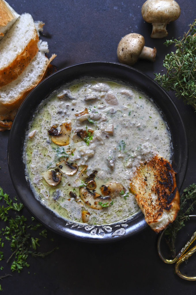 aerial shot of healthy mushroom soup in a black bowl