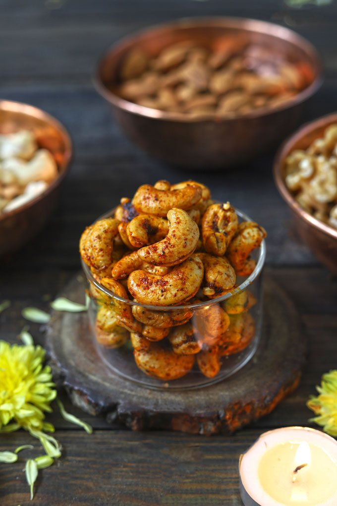 side close up shot of masala kaju in a glass bowl