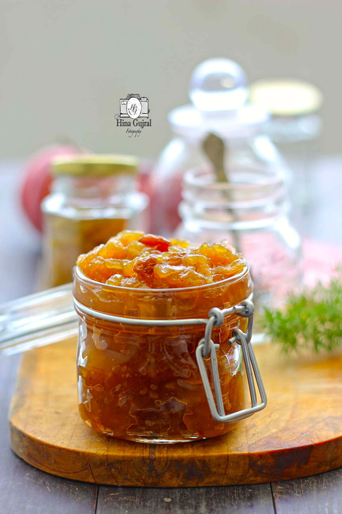 side shot of savory apple raisin chutney in a glass jar 