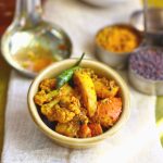 side close up shot of gobi gajar achar in a ceramic bowl