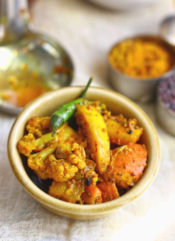 side close up shot of gobi gajar achar in a ceramic bowl