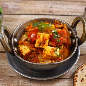 side shot of Kadai Paneer in a kadhai