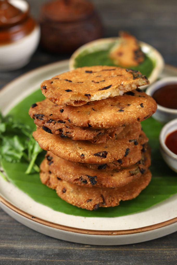 side shot of stacked maddur vadai on a banana leaf