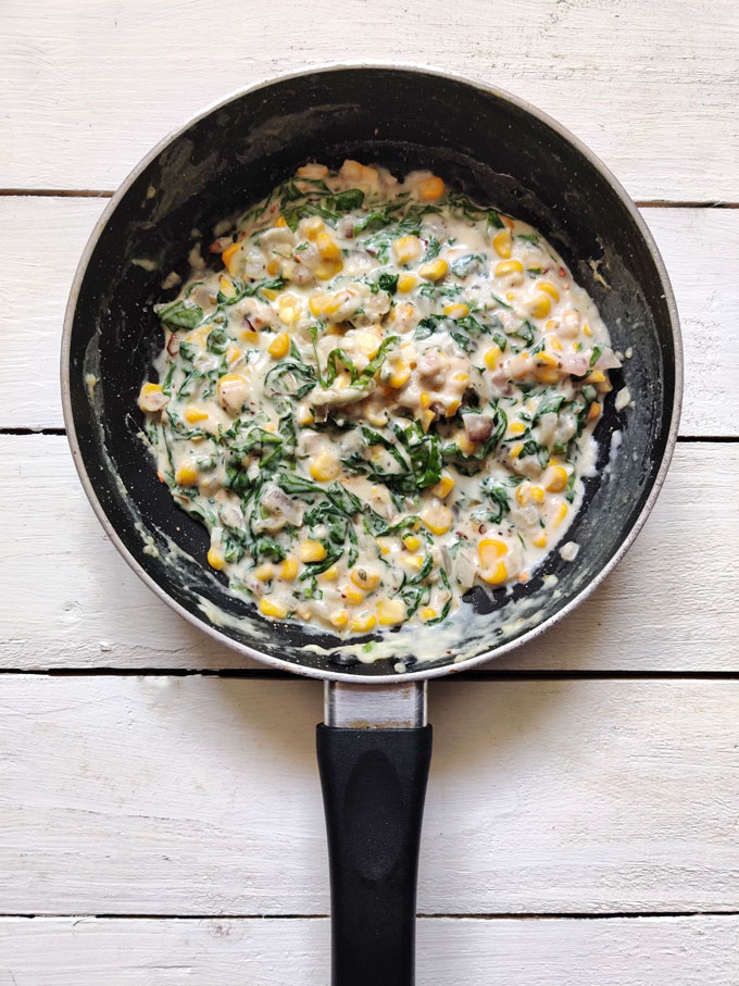 aerial shot of creamy spinach corn filling for sandwich