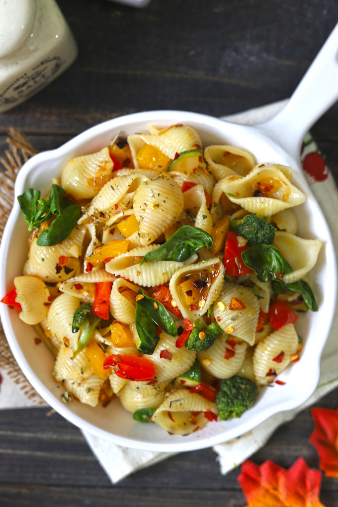 aerial shot of stir fry pasta with vegetables on a white pan