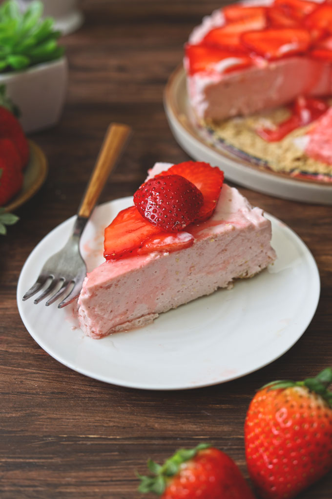 side shot of strawberry cheesecake slice