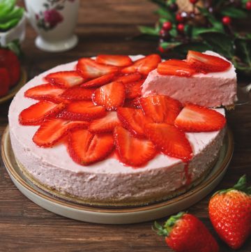 side shot of sliced no bake strawberry cheesecake